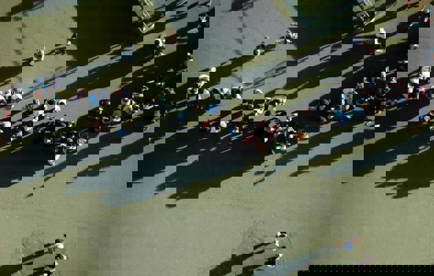 birdseye view of people in queue loading=