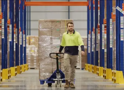 Man in warehouse aisle